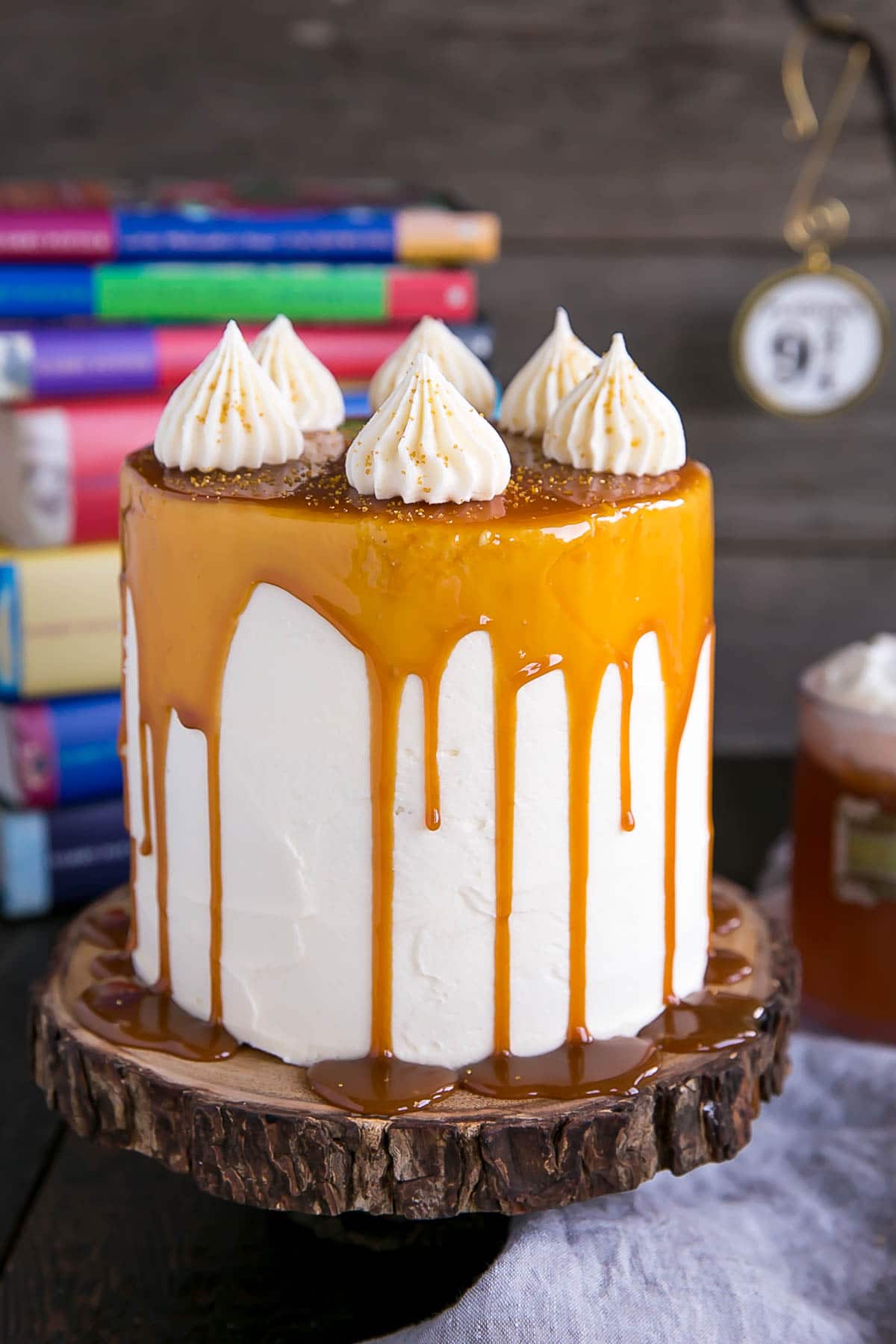 Harry Potter Cake! This Butterbeer cake combines butterscotch, cream soda, and marshmallow all in one spellbinding dessert. | livforcake.com Butterbeer Cake made with butterscotch, cream soda, and marshmallow.