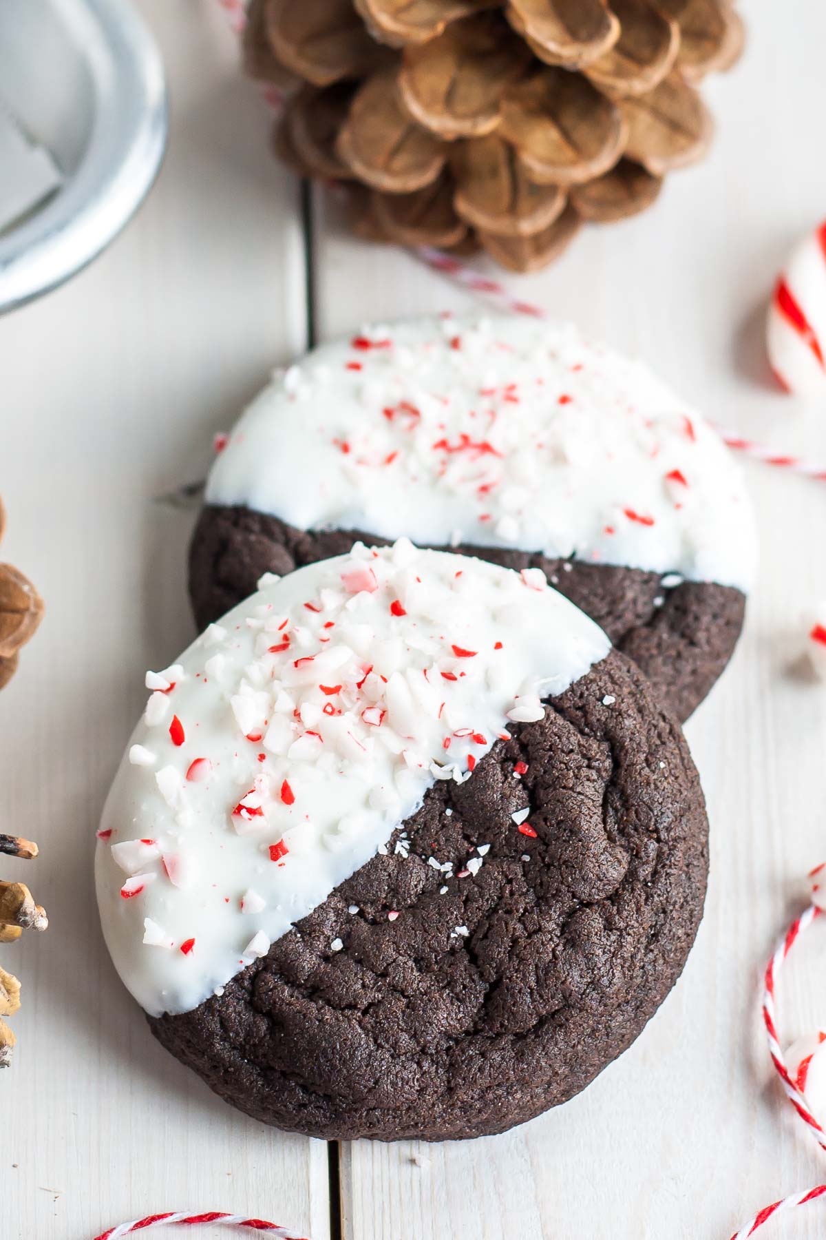 Dark Chocolate Candy Cane Cookies! The classic combination of chocolate and peppermint make these Dark Chocolate Candy Cane Cookies the perfect treat for the holidays! | livforcake.com Dark Chocolate Cookies Dipped in White Chocolate and sprinkled with chopped candy canes.