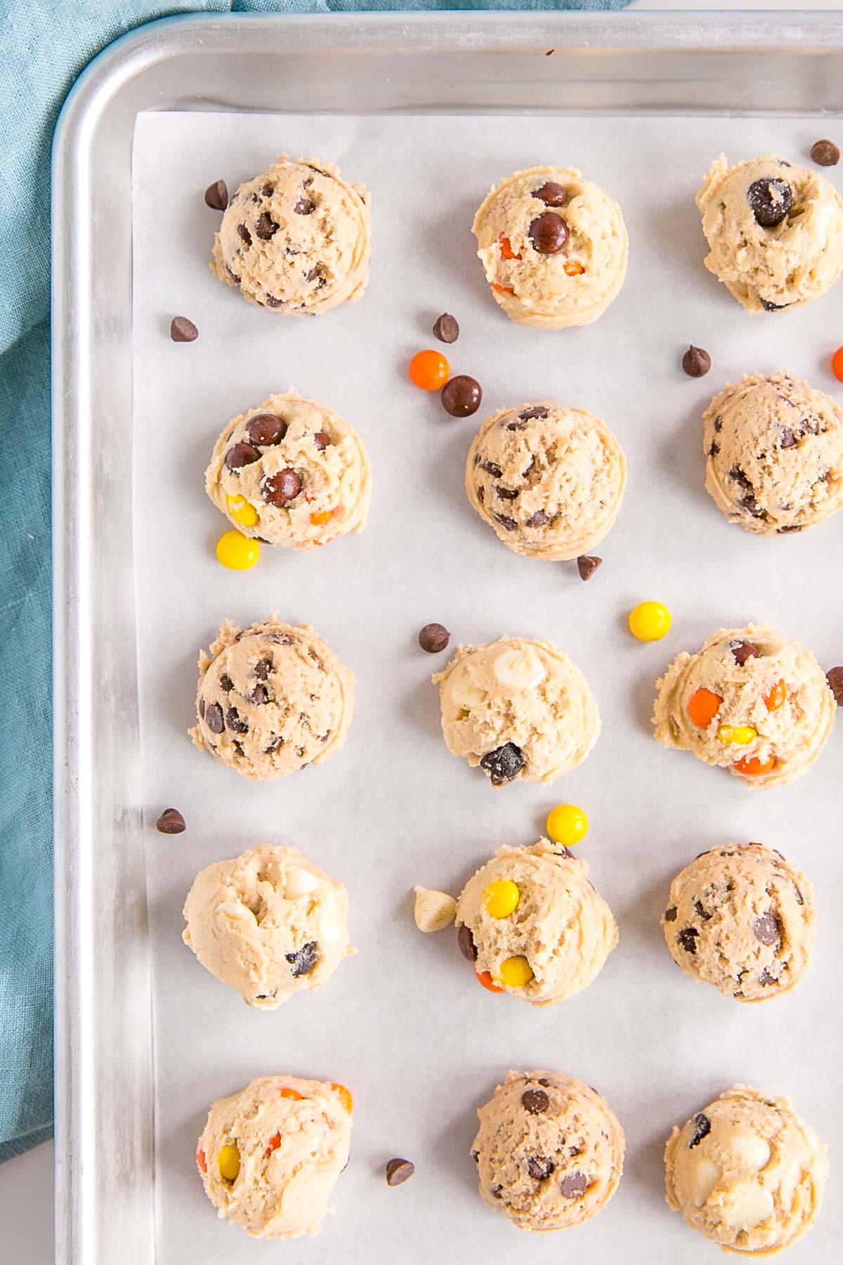 Portioned balls of dough on a baking sheet ready for the freezer.