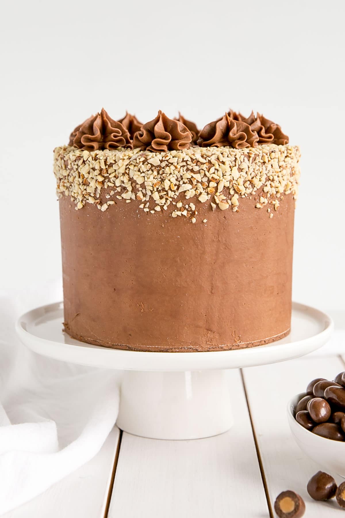 Milk Chocolate Almond Cake! Fluffy almond cake layers with a milk chocolate ganache.