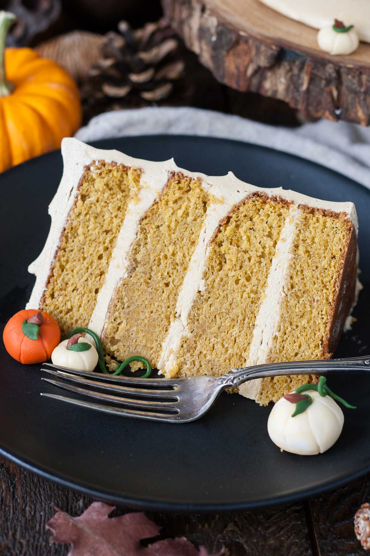 This Pumpkin Spice Latte Cake is your favorite Fall beverage in cake form! Pumpkin spice cake with an espresso buttercream. | livforcake.com Slice of Pumpkin Spice Latte Cake