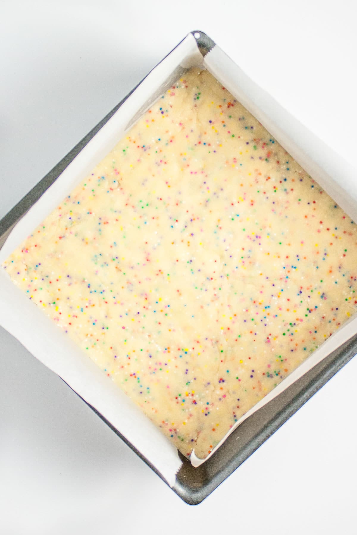 Overhead shot of the shortbread in the pan before baking.